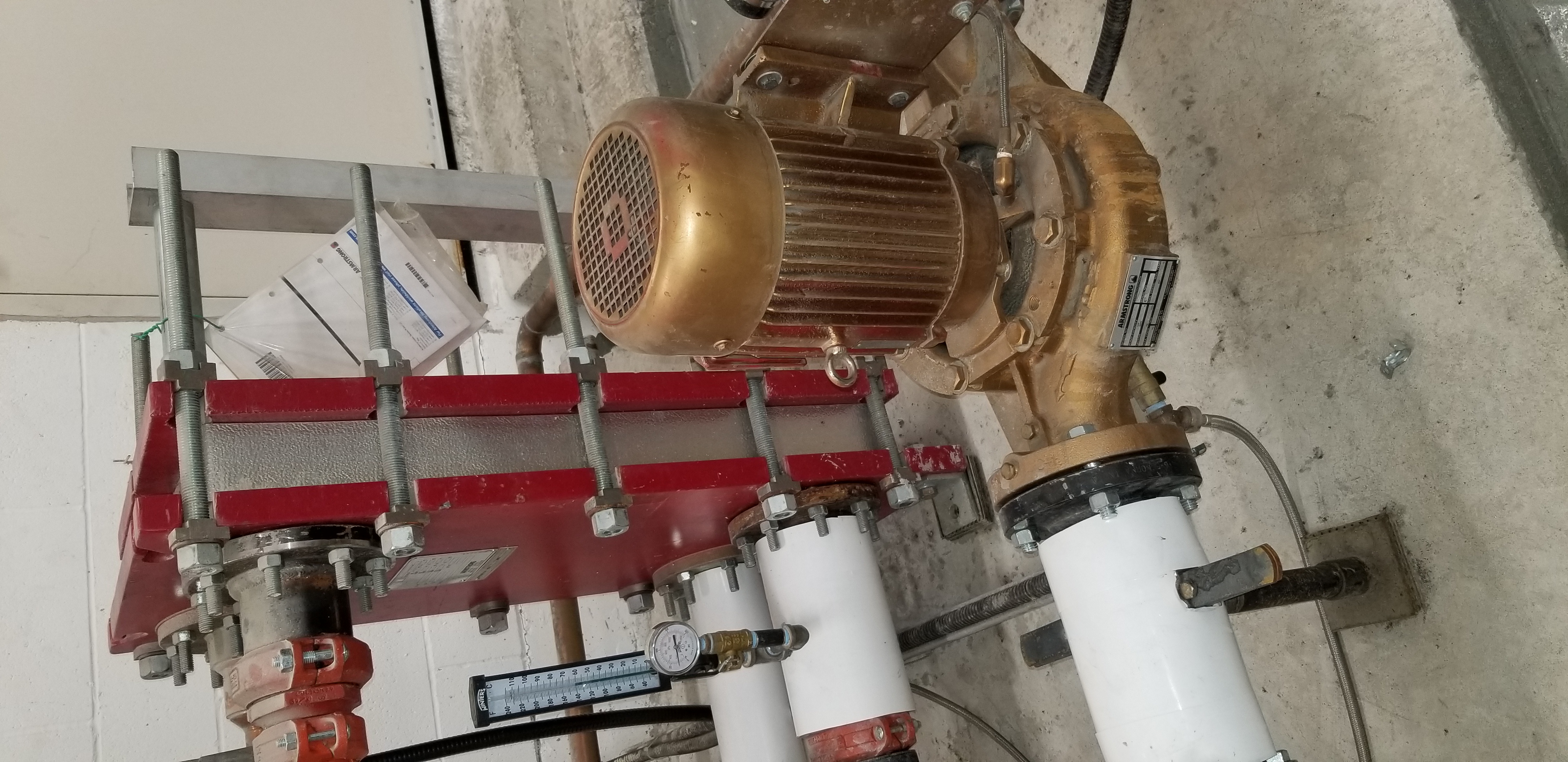 Plate heat exchanger with Armstrong bronze pump installed by Temperature Control Solutions